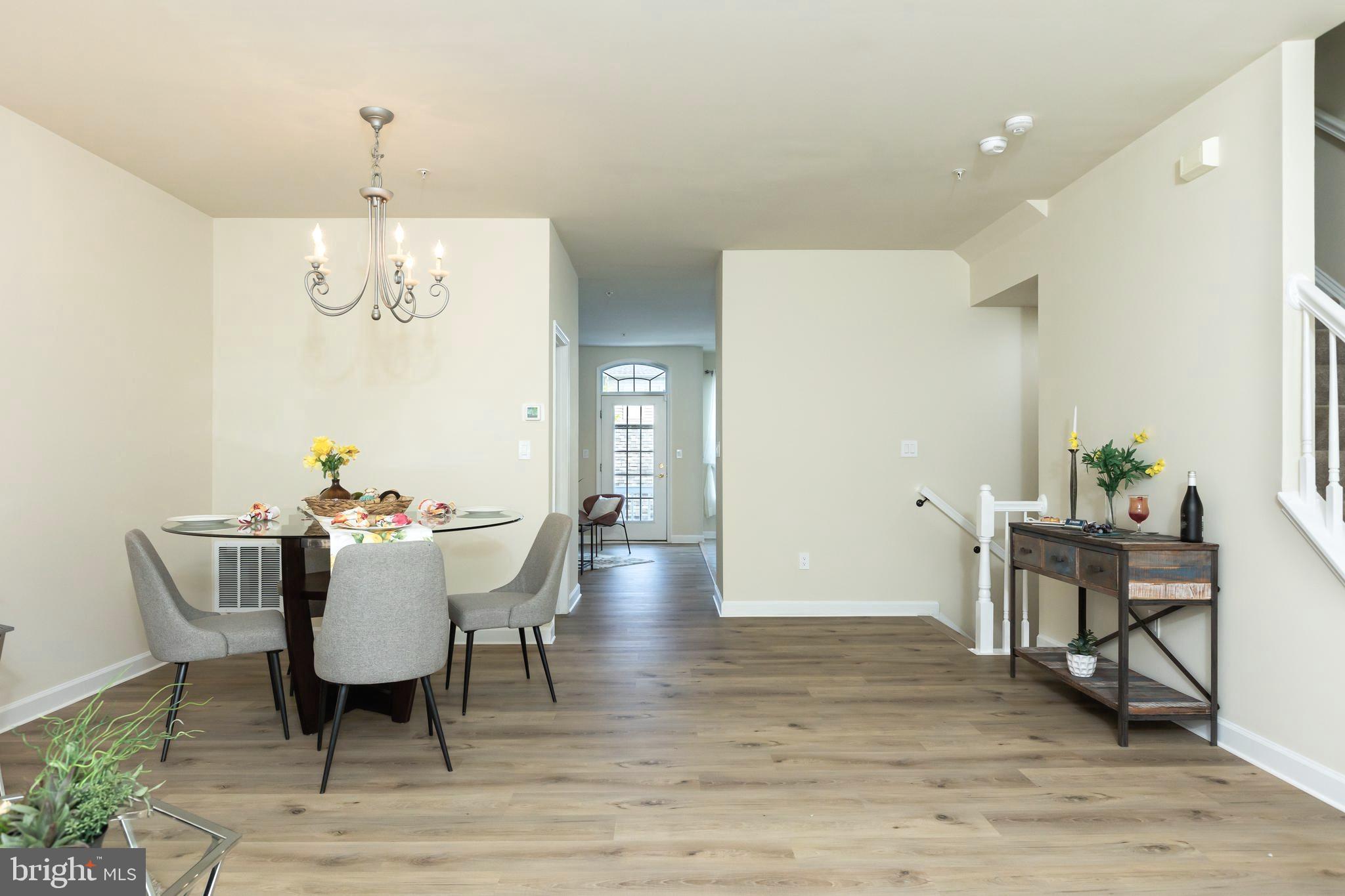 637 Spectator Avenue Landover, MD 20785 - Photo 7 of 54 a view of a dining room with furniture window and wooden floor