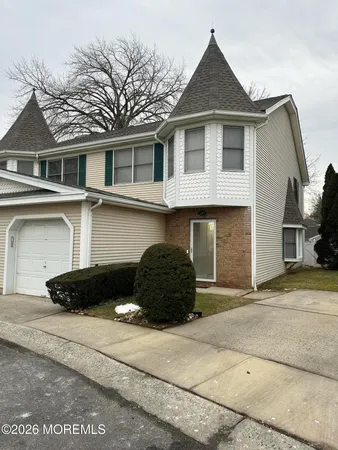 a front view of a house with a garage