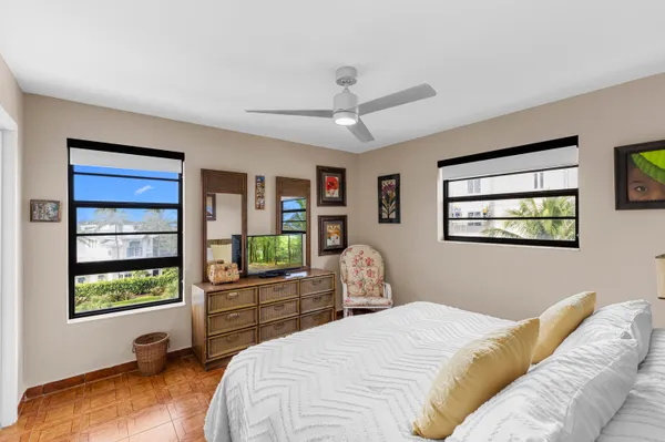 a bedroom with a bed and a flat tv screen