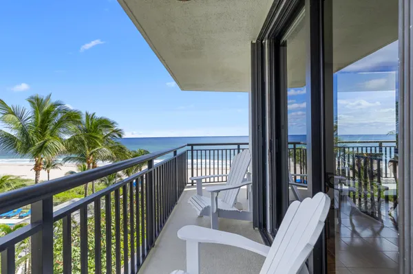 a view of balcony with furniture