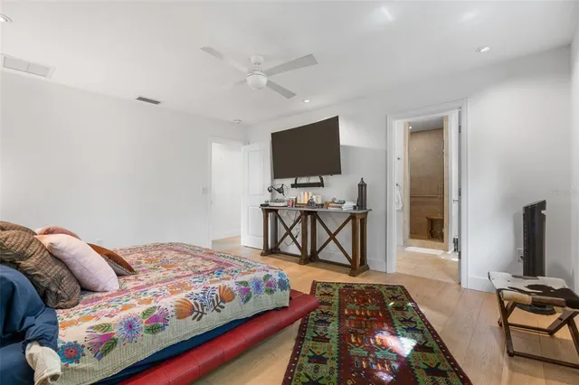 a bathroom with a granite countertop double vanity sink and a mirror
