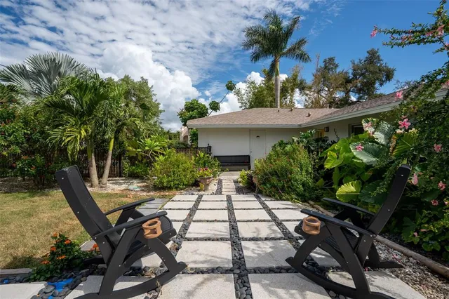 a view of house with yard