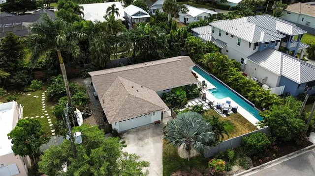 an aerial view of a house with outdoor space