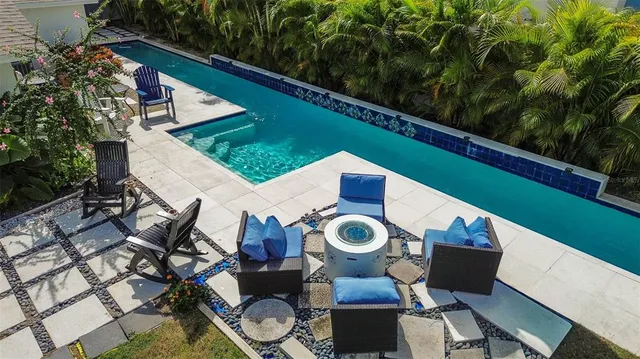 a view of a chairs and table in patio