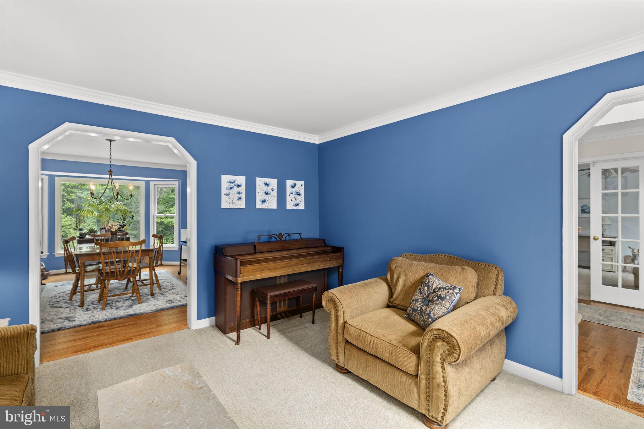 100 Boscobel Road Fredericksburg, VA 22405 - Photo 36 of 67 a living room with furniture and a floor to ceiling window