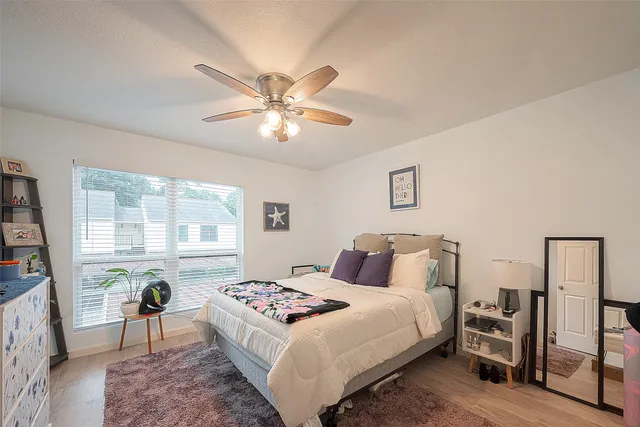 a bedroom with a bed and a table in it