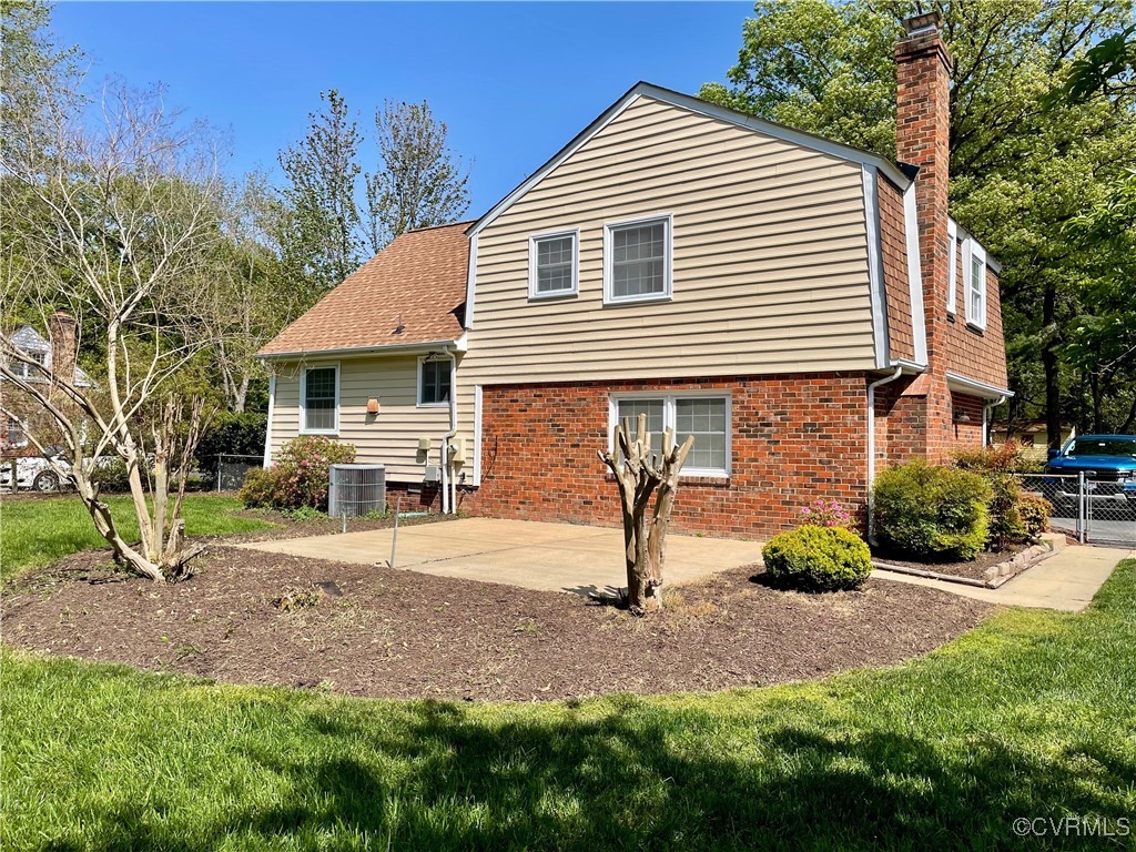 1410 Warminster Drive Midlothian, VA 23113 - Photo 20 of 22 a front view of a house with garden