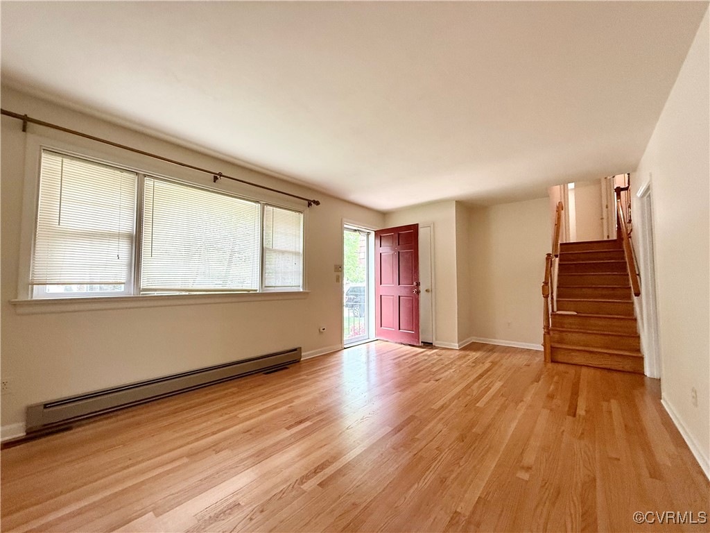 1410 Warminster Drive Midlothian, VA 23113 - Photo 2 of 22 a view of an empty room with wooden floor and a window