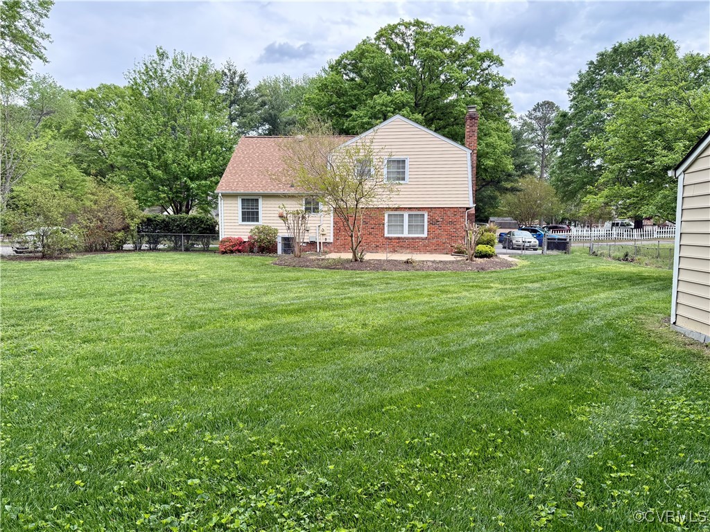 1410 Warminster Drive Midlothian, VA 23113 - Photo 22 of 22 a front view of a house with garden