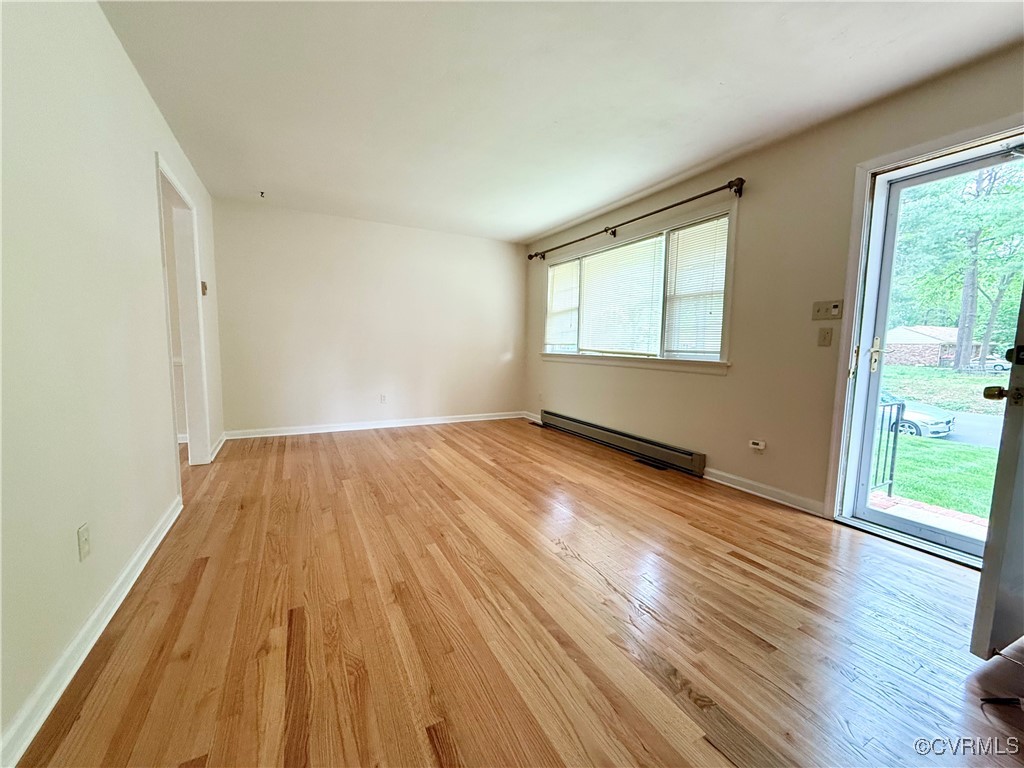 1410 Warminster Drive Midlothian, VA 23113 - Photo 3 of 22 an empty room with wooden floor and windows
