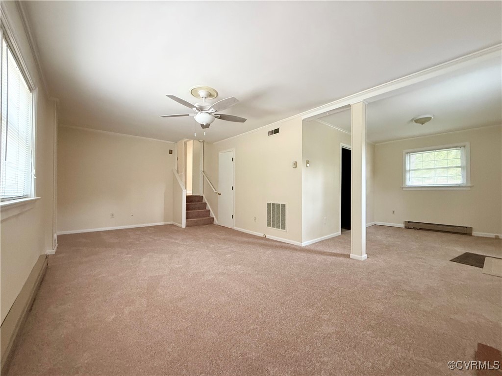 1410 Warminster Drive Midlothian, VA 23113 - Photo 8 of 22 an empty room with a window and a ceiling fan