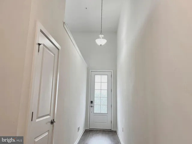 a view of a hallway with windows