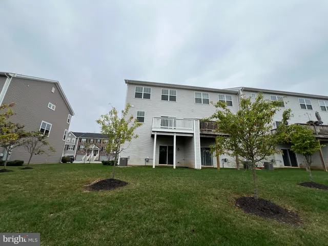 a front view of house with a garden