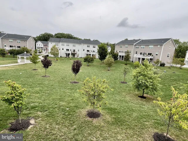 a view of multiple houses with outdoor space