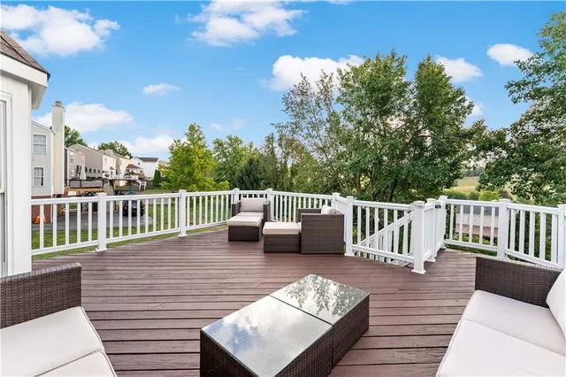 a view of a house with a patio and a yard