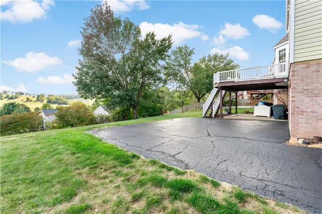 a view of a park with large trees