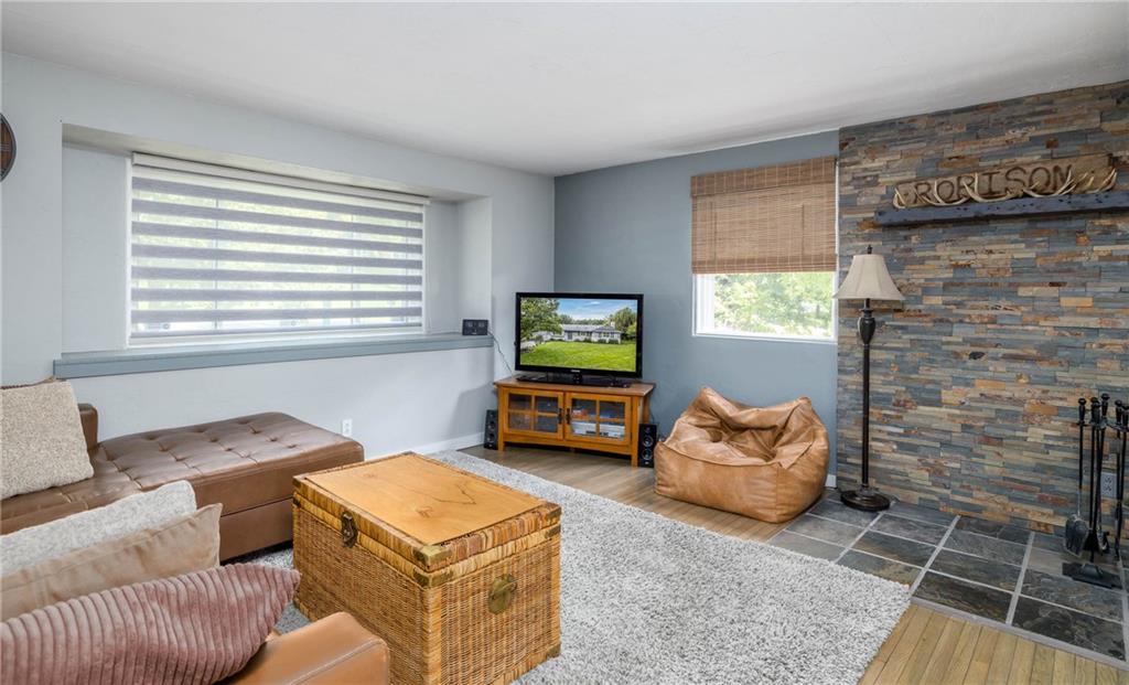 The wide expansion of windows allows the natural light into the living room.
