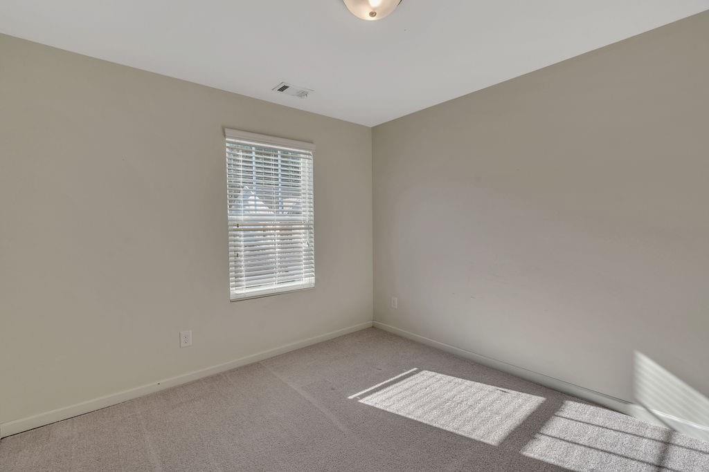 1938 Millstream Hollow Conyers, GA 30012 - Photo 12 of 16 a view of an empty room and window