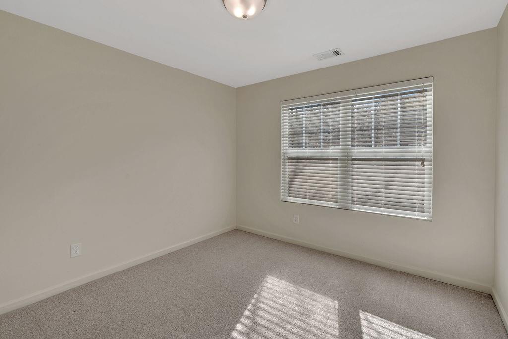 1938 Millstream Hollow Conyers, GA 30012 - Photo 14 of 16 a view of an empty room with a window