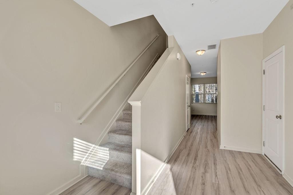 1938 Millstream Hollow Conyers, GA 30012 - Photo 2 of 16 a view of entryway and hall with wooden floor
