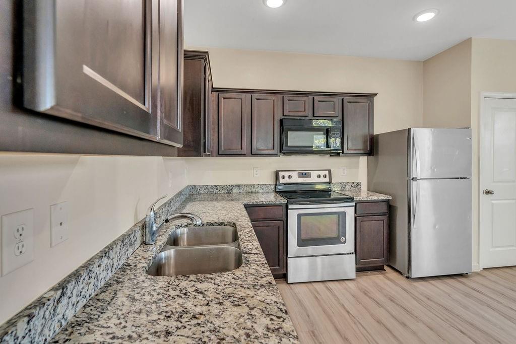 1938 Millstream Hollow Conyers, GA 30012 - Photo 6 of 16 a kitchen with a refrigerator sink and stove
