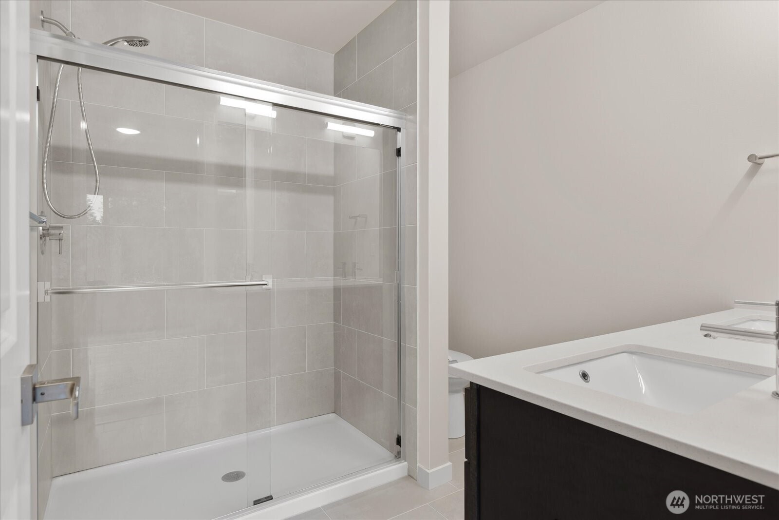 23413 Edmonds Way, Unit A2 Edmonds, WA 98026 - Photo 23 of 40 a bathroom with a bathtub and a shower