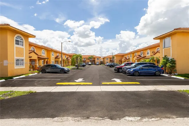 a view of street with parked cars