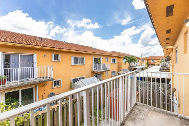 a view of a balcony with car parked