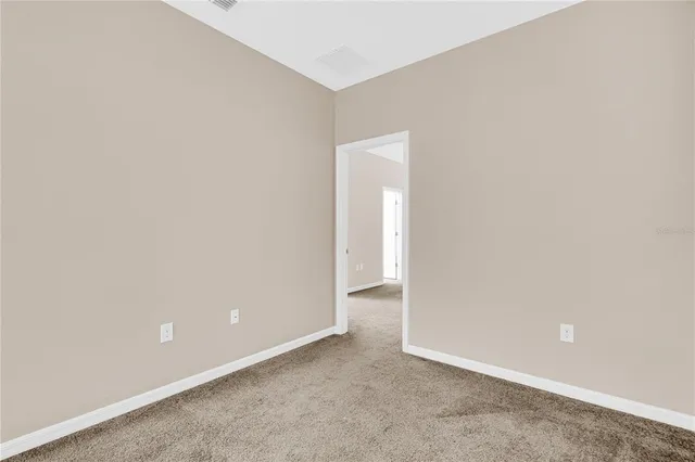 an empty room with closet area