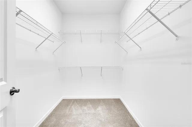 a view of storage and utility room with washer and dryer