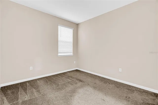 a buildings covered with tall trees