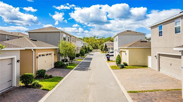 an aerial view of residential house with outdoor space and swimming pool