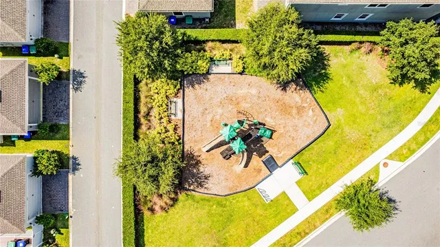 aerial view of residential houses with yard and swimming pool