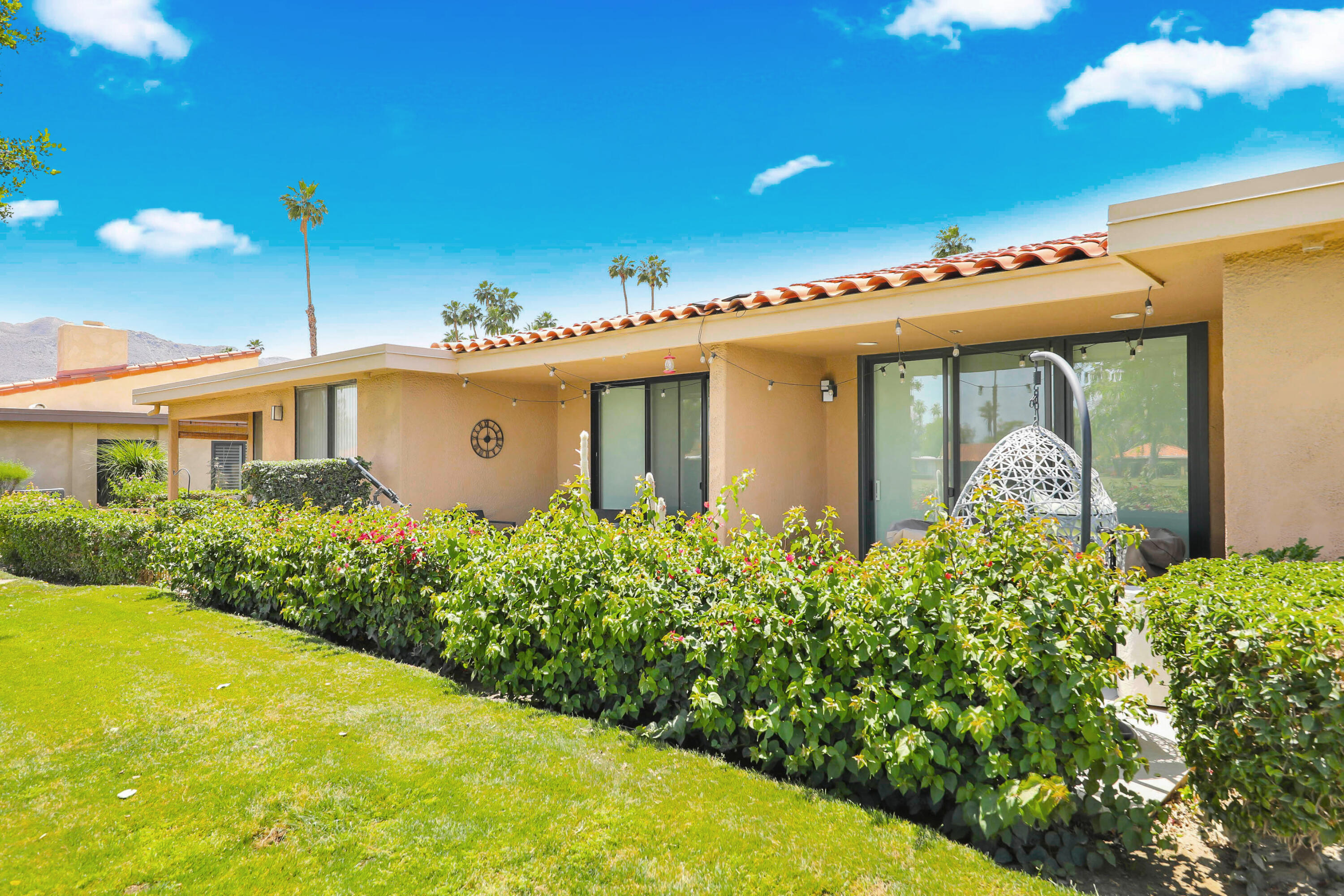 23 Haig Drive Rancho Mirage, CA 92270 - Photo 23 of 49 a front view of a house with a yard