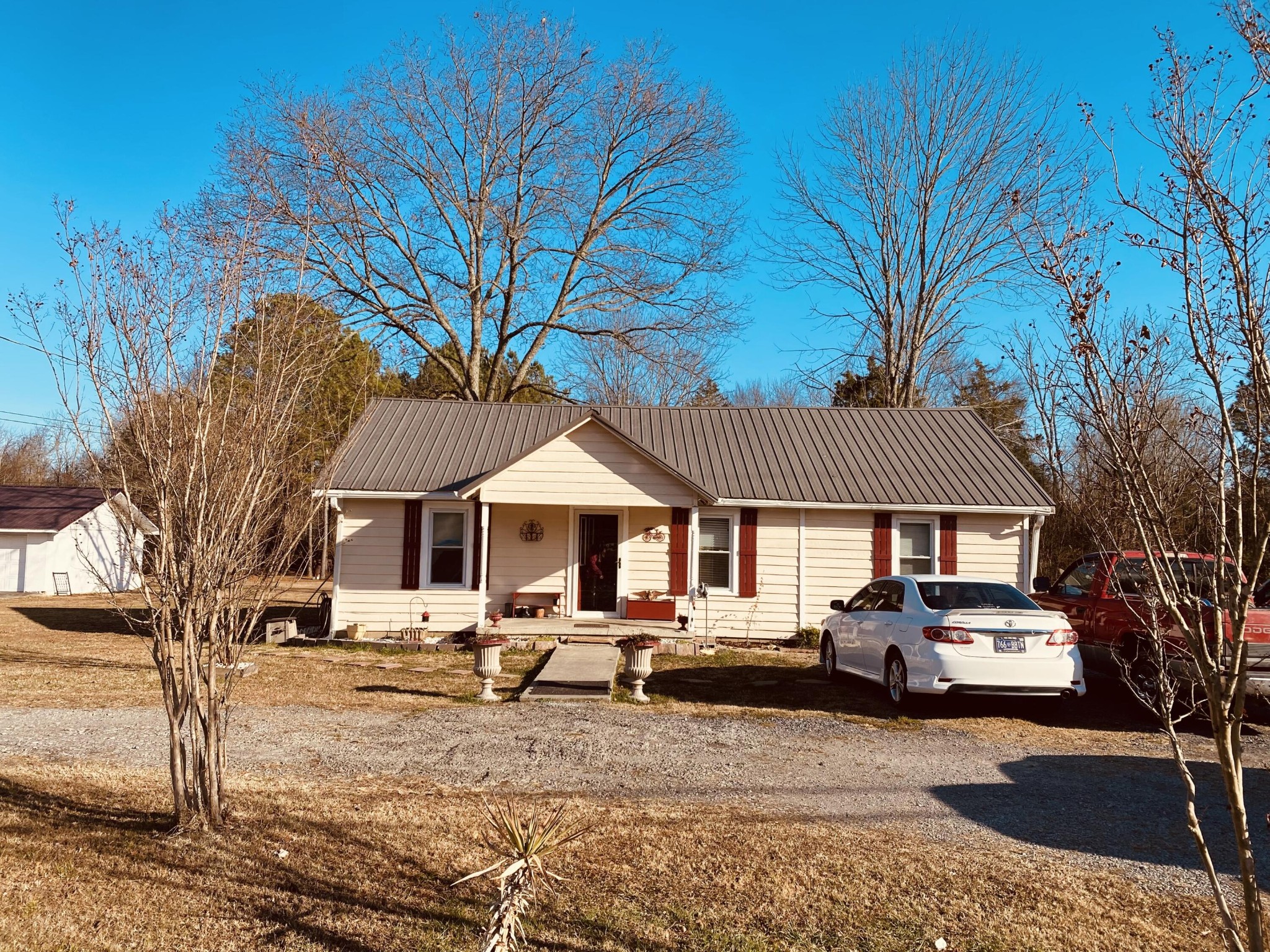 725 Durkee Road Southeast Cleveland, TN 37323 - Photo 24 of 24 a car parked in front of white house