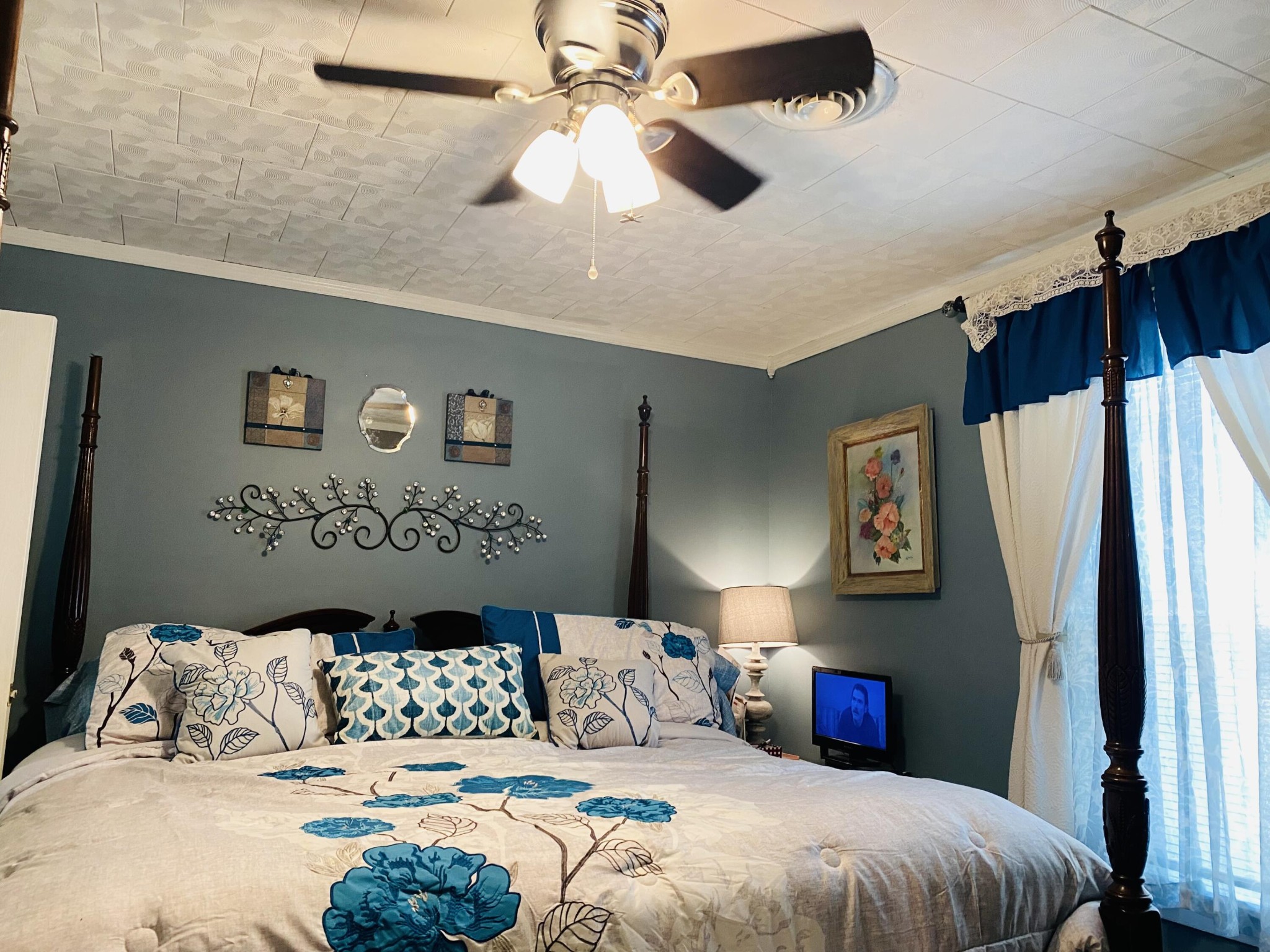725 Durkee Road Southeast Cleveland, TN 37323 - Photo 9 of 24 a bedroom with a large bed and a chandelier