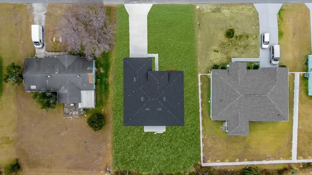 a kitchen with stainless steel appliances kitchen island granite countertop a stove a sink a center island and cabinets