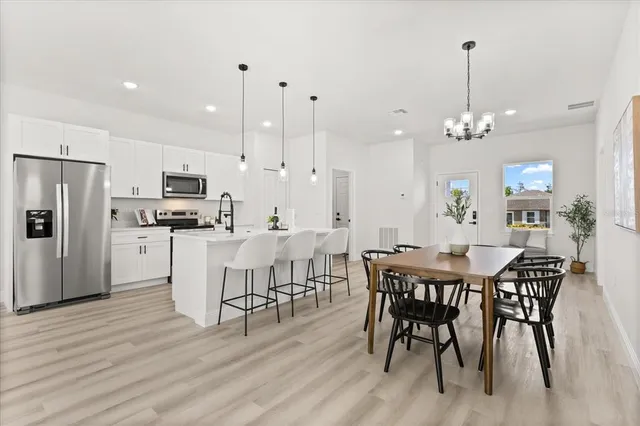 a bedroom with a bed and a potted plant