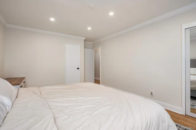 a large white bed in a white room