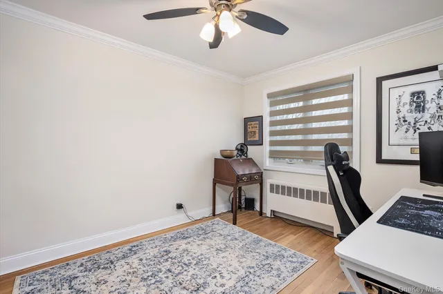 a view of a livingroom with furniture and a window