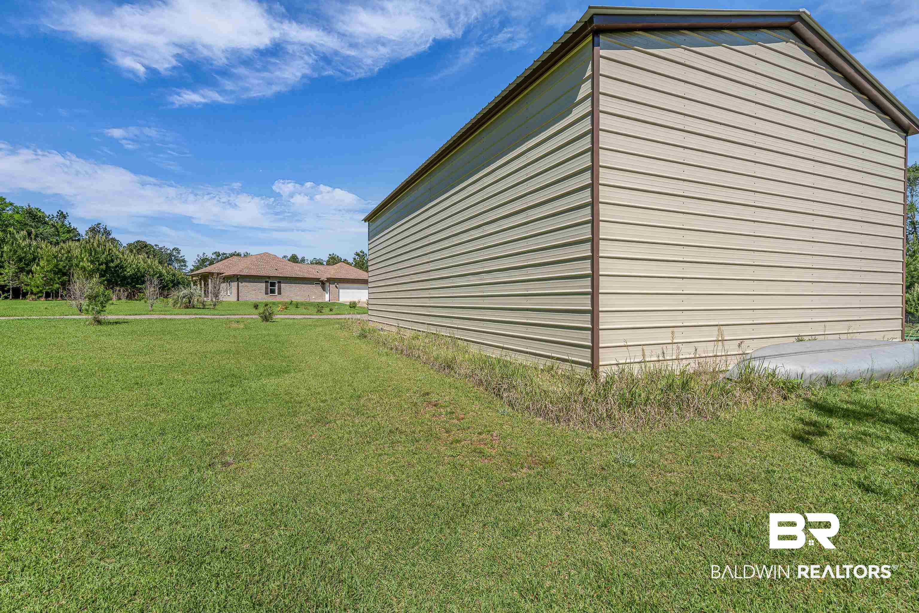 18255 Cactus Court Elberta, AL 36530 - Photo 39 of 53 View of property exterior featuring a lawn