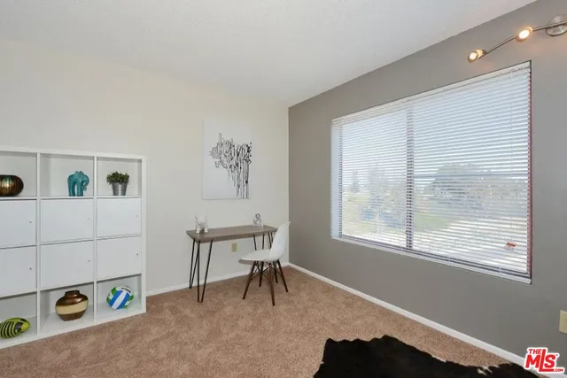 swimming pool with seating space and water view