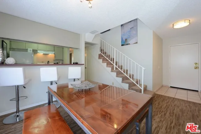 a view of kitchen island with wooden floor