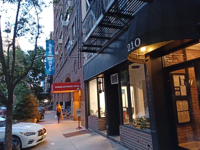 a kitchen with kitchen island wooden floors and stainless steel appliances