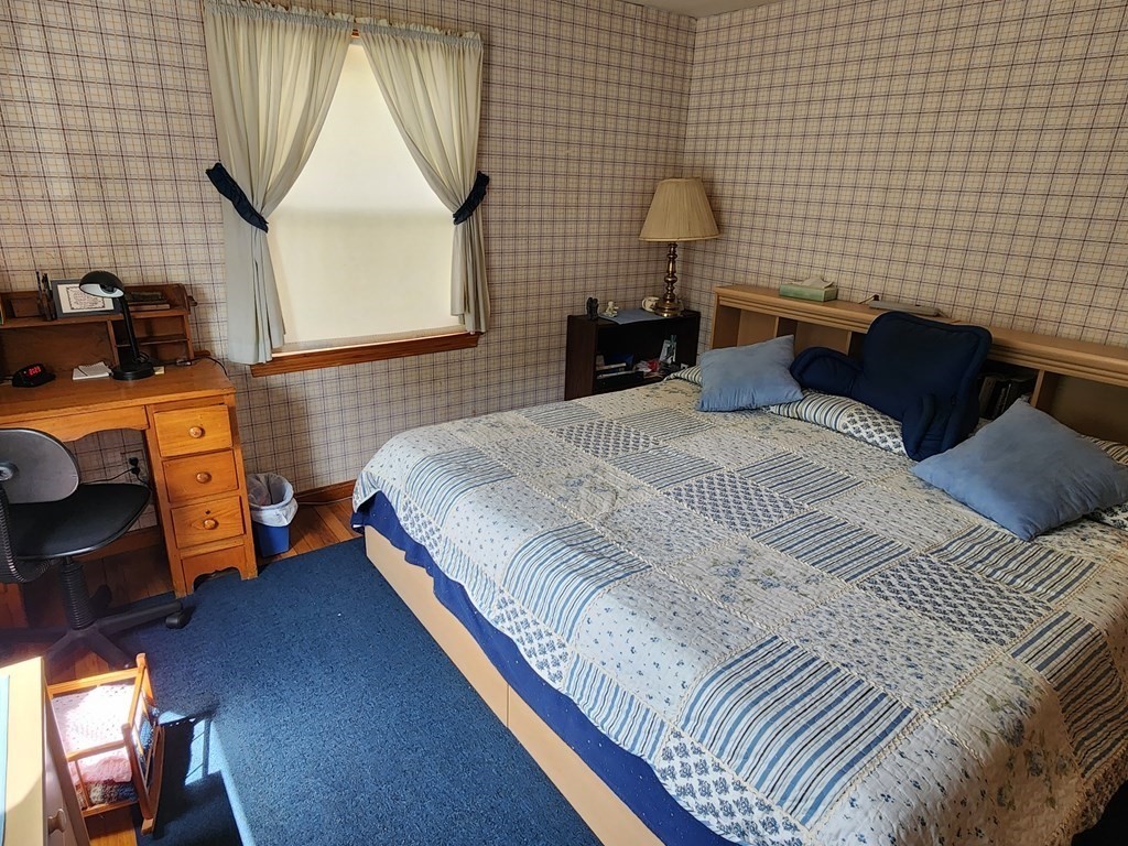 946 Bradley Road Springfield, MA 01109 - Photo 14 of 16 a bedroom with a bed and a window