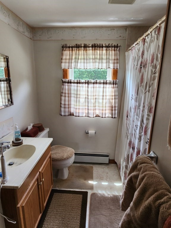 946 Bradley Road Springfield, MA 01109 - Photo 15 of 16 a bathroom with a sink a toilet and shower