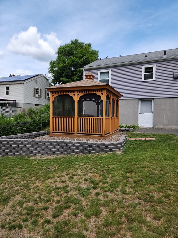 946 Bradley Road Springfield, MA 01109 - Photo 6 of 16 a front view of a house with a garden