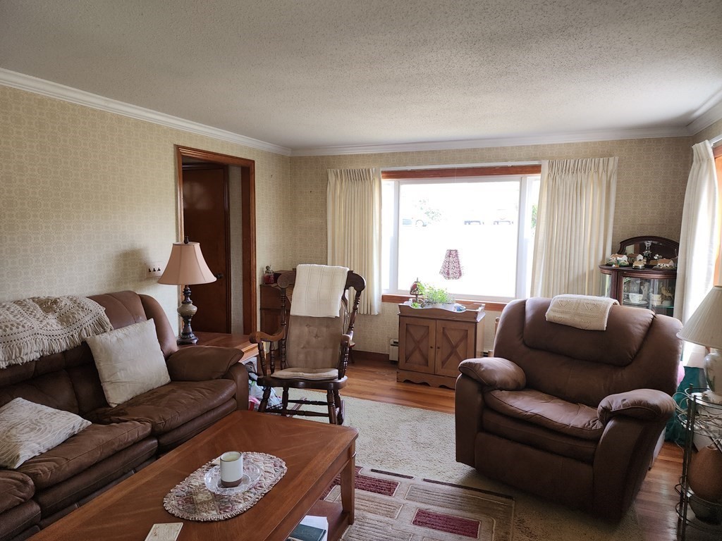 946 Bradley Road Springfield, MA 01109 - Photo 10 of 16 a living room with furniture and a large window