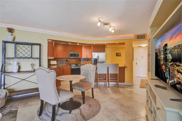 a dining room with furniture and window