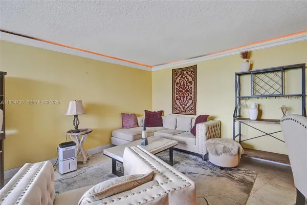 a living room with furniture and a table